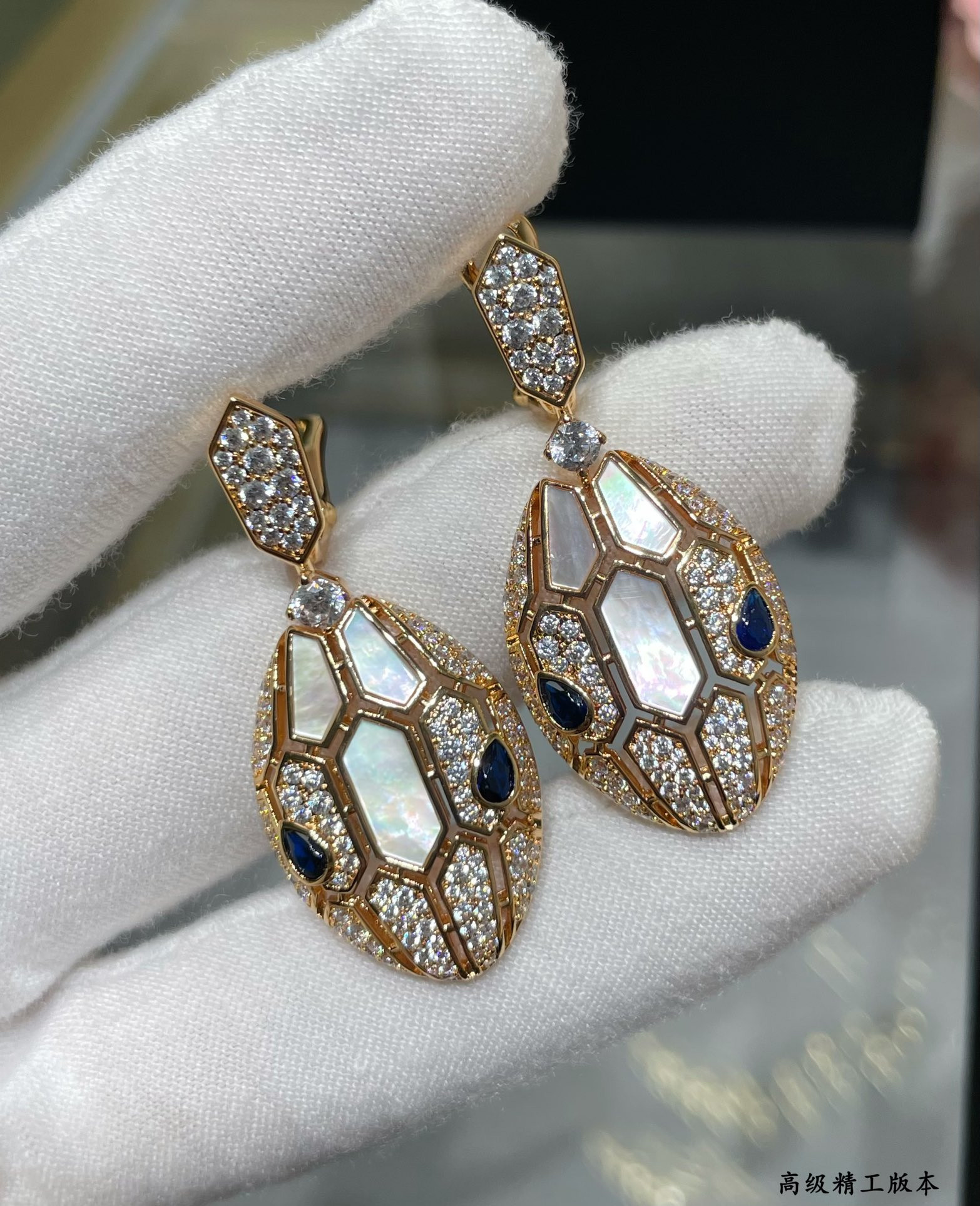 B*l*ai snakes earrings