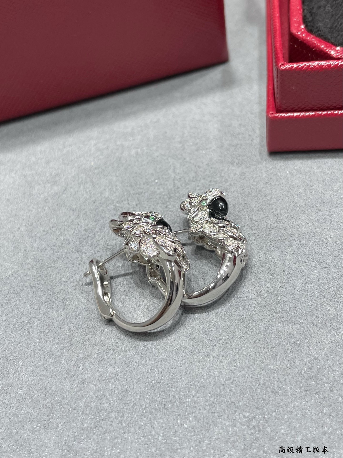 Ca*t*er parrot earrings