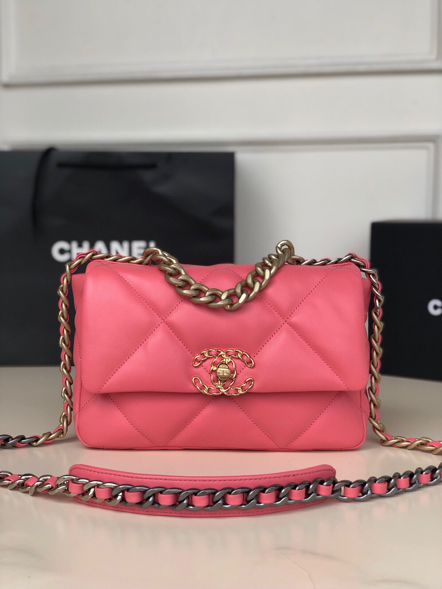 Ch*el 19 handbag shiny leather, gold-tone, silver-tone & ruthenium-finish metal pink 6.2 × 10.1 × 3.5 in