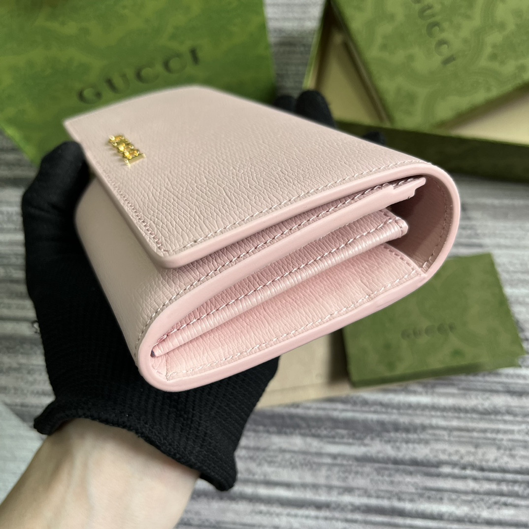 continental wallet with G*u*i script pink 7.5"w x 4"h x 1.4"d