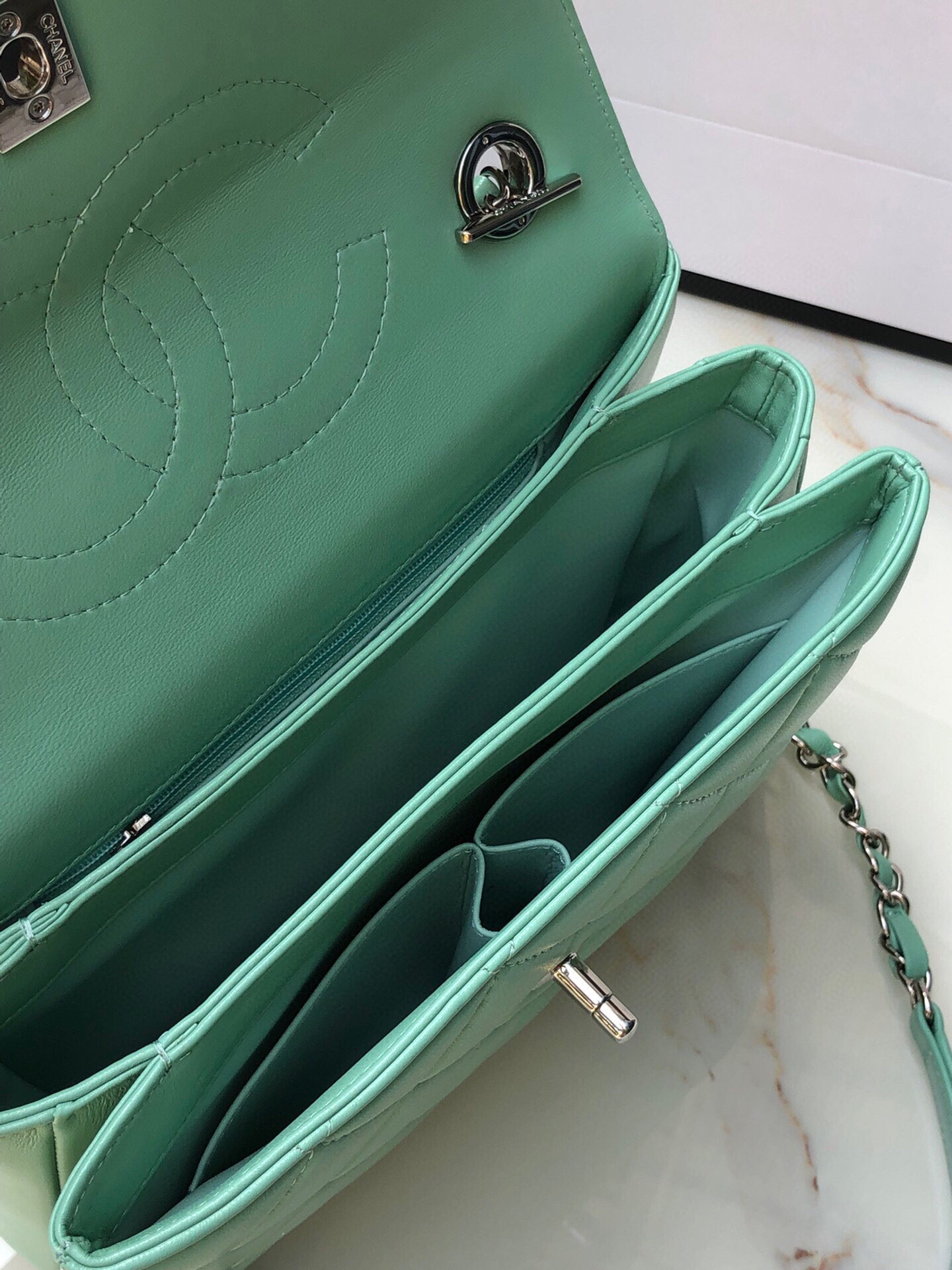Ch*el flap bag with top handle 6.6 × 9.8 × 4.7 in