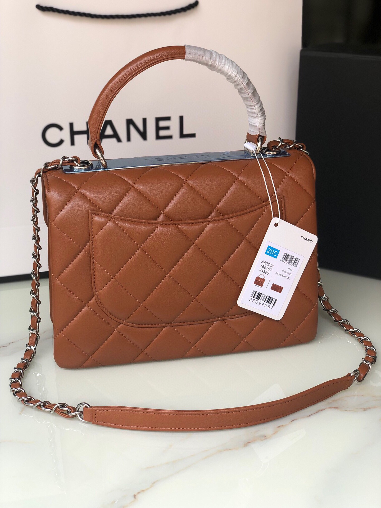 Ch*el flap bag with top handle 6.6 × 9.8 × 4.7 in