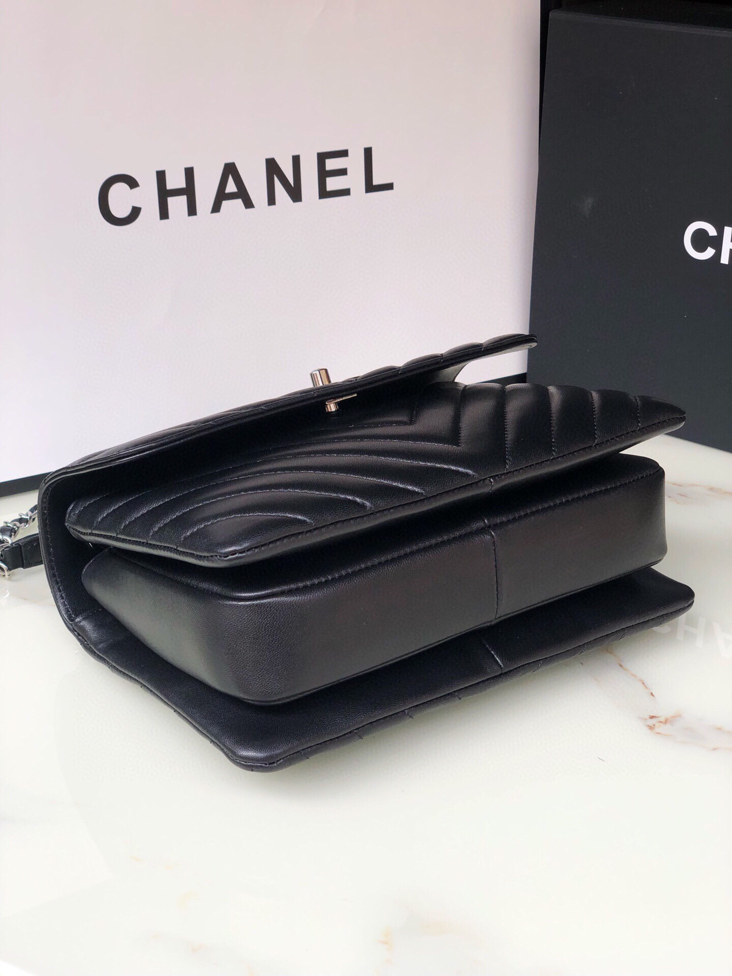 Ch*el flap bag with top handle 6.6 × 9.8 × 4.7 in