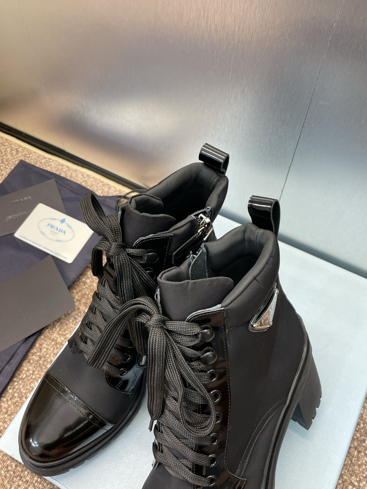 ua Pra*a re-nylon and leather booties